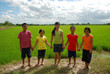 Children hanging in the rice field Children hanging in the rice field