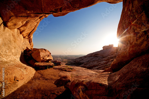 Photo: Cave and sunset in the desert mountains Cave and sunset in the desert mountains