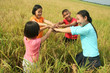 Children hanging in the rice field