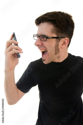 Photo: Man yelling into phone Man yelling into phone