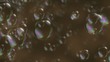 soap bubbles spreading and bursting