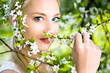 Woman smelling flowers