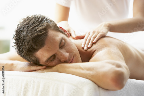 Photo: Young Man Enjoying Massage At Spa Young Man Enjoying Massage At Spa