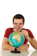 Man looking at globe