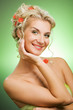 Beautiful young woman with flowers in her hair.