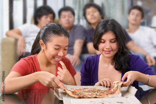 Photo: Girls got the first chance to eat pizza Girls got the first chance to eat pizza