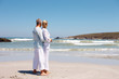 Rear view of a romantic mature couple in love on the beach