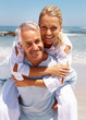 Foto: Mature couple enjoying their beach holiday Mature couple enjoying their beach holiday
