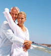 An aged couple on a vacation caring for each other