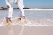Low section image of an old couple at the beach