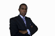 Businessman with arms crossed, portrait, low angle view, cut out