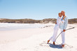 A lovely old couple hugging each other at the beach