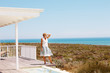 Mature woman standing alone and thinking