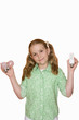Girl holding up light bulbs, portrait, cut out