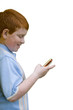 Boy with mobile phone, smiling, side view, cut out