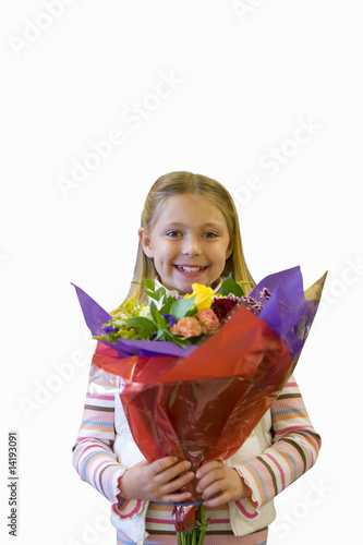 Photo: Girl holding bunch of fresh flowers, cut out Girl holding bunch of fresh flowers, cut out