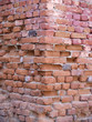 Corner of an old red brick wall