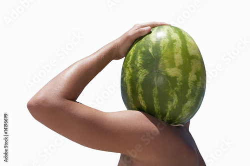 Photo: Man carrying watermelon on shoulder, face obscured, profile, cut out Man carrying watermelon on shoulder, face obscured, profile, cut out