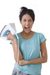 young woman holding iron, cut out