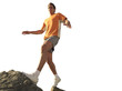 man walking up rocks with arms out, cut out