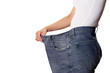 Woman showing how much weight she lost.