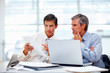 Successful business men working together at a meeting