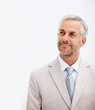 Attractive senior business man looking towards copyspace