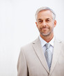 Cheerful aged business man smiling confidently