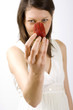 Photo: woman holding a strawberry woman holding a strawberry