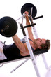 Foto: Man lying on bench and doing weightlifting Man lying on bench and doing weightlifting