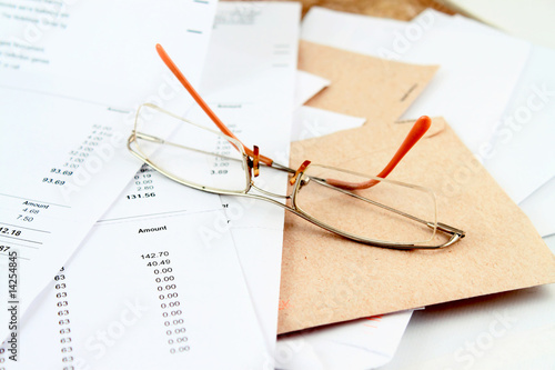 Photo: Bills and glasses Bills and glasses