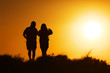 Couple walking at sunset