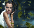 portrait of the beautiful woman with feathers