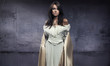 lovely woman in the beautiful dress, dark room