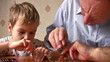 child with senior repair glasses