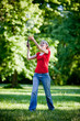 girl playing badminton in the park 2