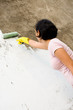 independent woman painting exterior wall independent woman painting exterior wall
