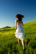 Young woman running on a beautiful springfield