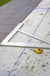 tile-layer who poses tiling on a terrace