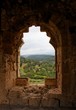 Green hills seen through window of ruined ancient castle Green hills seen through window of ruined ancient castle
