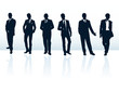 Set of dark blue vector businessman silhouettes in suits.