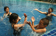 Group of children playing in the pool.
