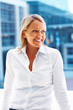 Happy successful business woman looking away