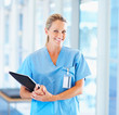 A female doctor standing with a confident smile