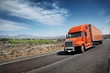Orange American truck on freeway
