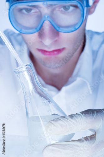 Photo: Man working in the chemistry laboratory Man working in the chemistry laboratory