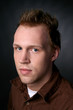 Photo: attractive young man with a brown shirt attractive young man with a brown shirt