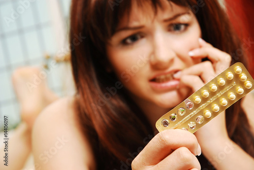 Photo: Girl worrying about her contaception Girl worrying about her contaception