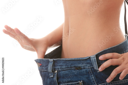 Photo: Female became skinny and wearing old jeans Female became skinny and wearing old jeans