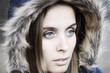 Portrait of a beautiful blue eyed young woman with a hood Portrait of a beautiful blue eyed young woman with a hood